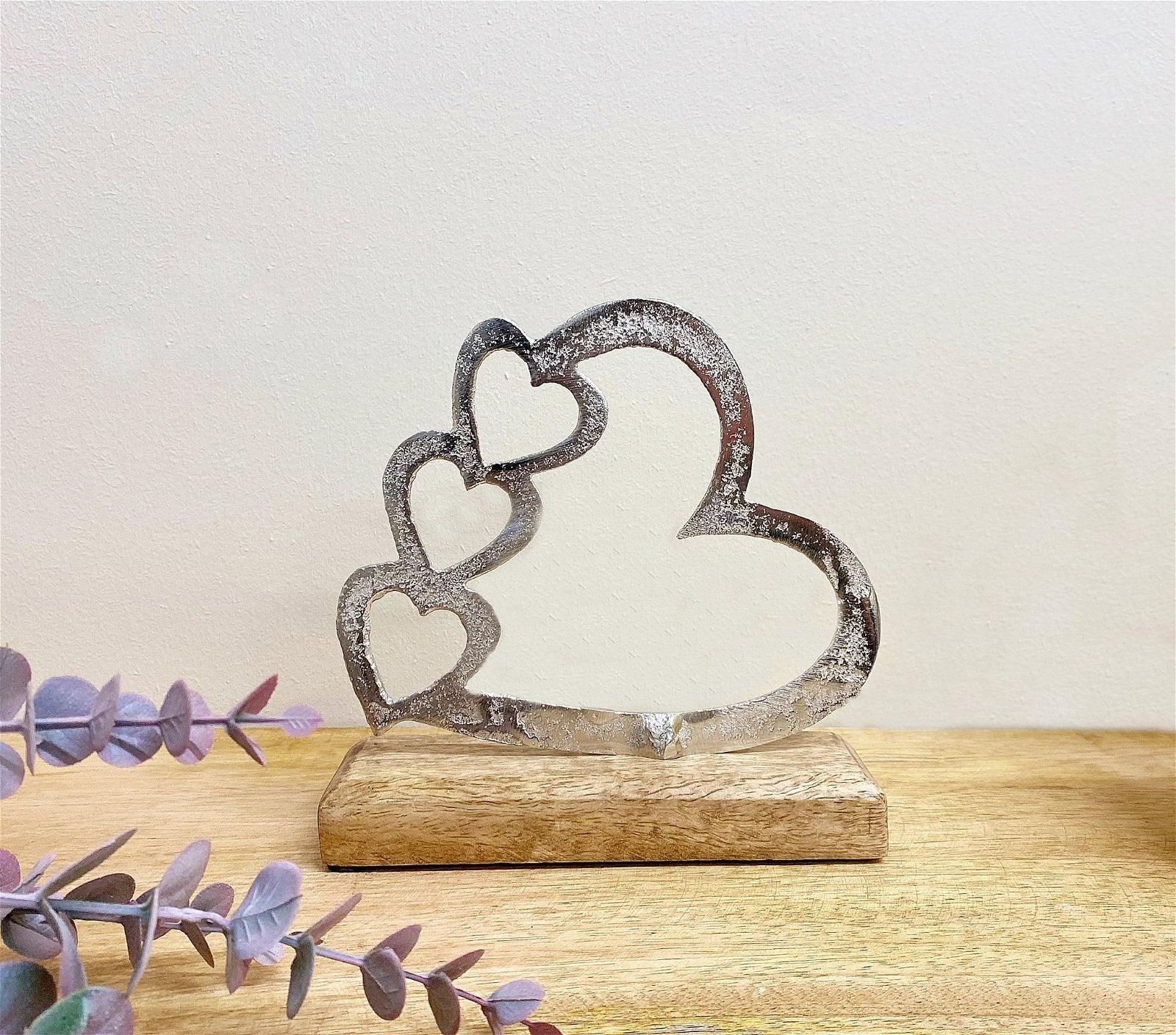 Metal Silver Four Heart Ornament On A Wooden Base Small-