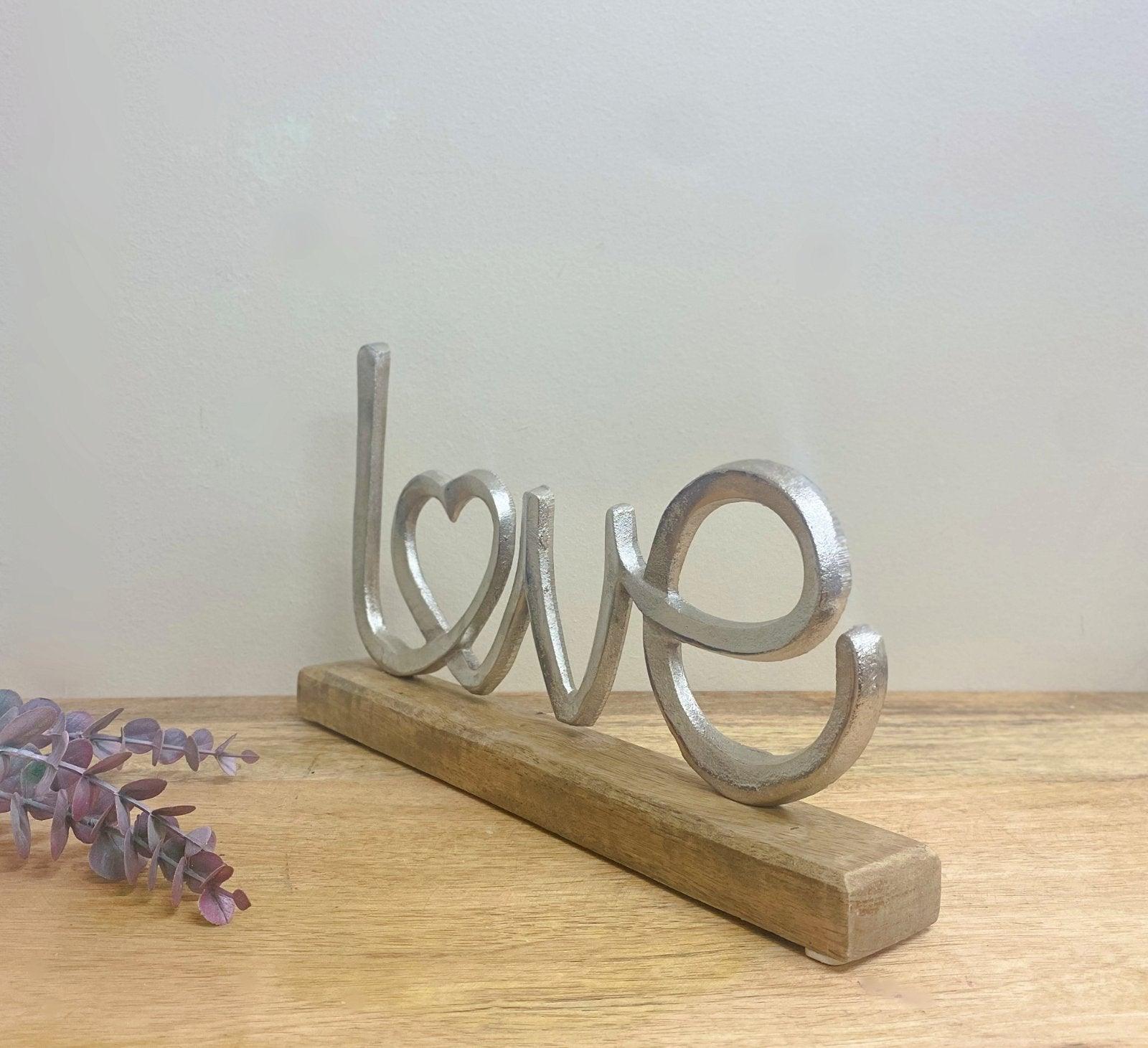 Metal Silver Love Ornament On A Wooden Base-